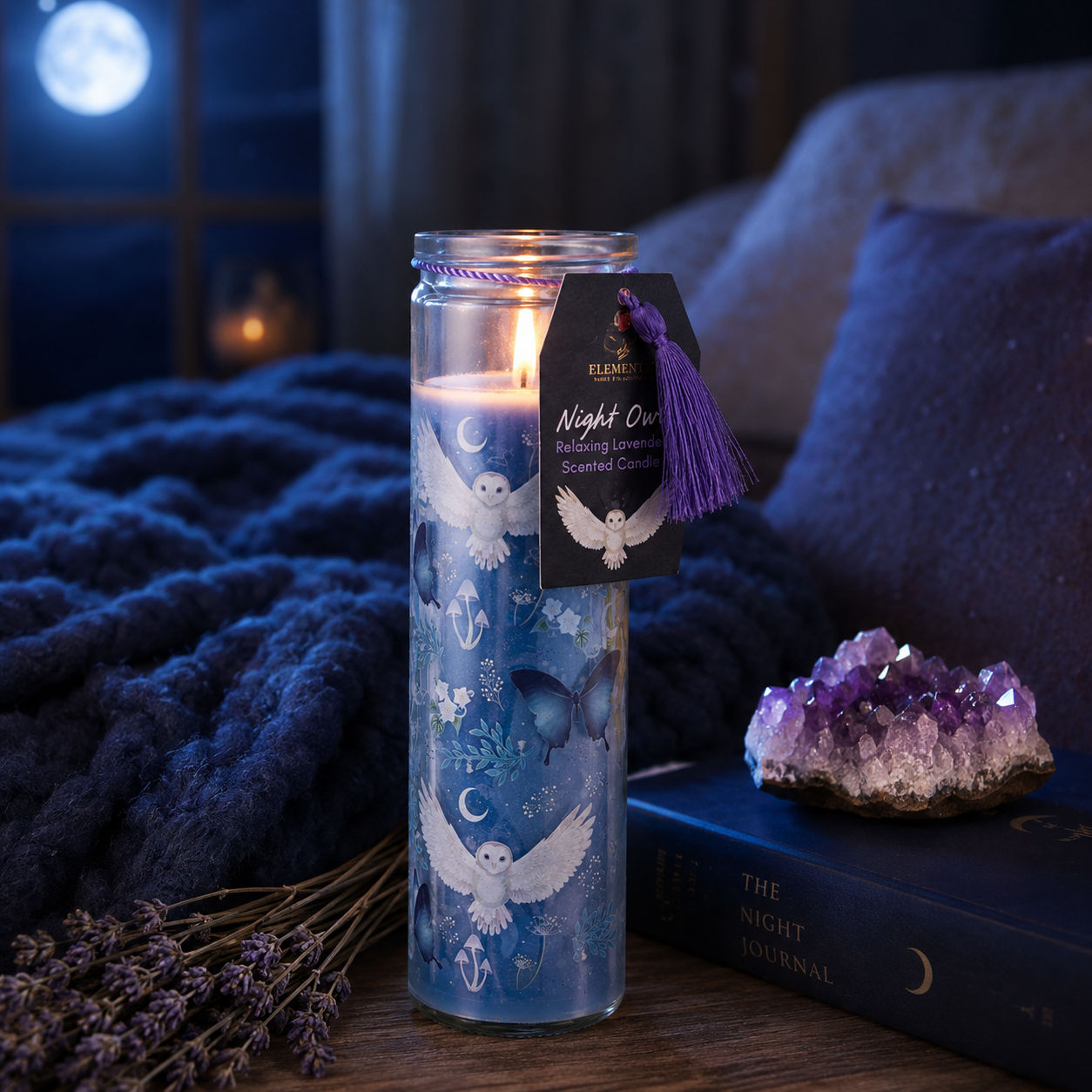 Decorative candle with owl design on a table with lavender and amethyst crystal